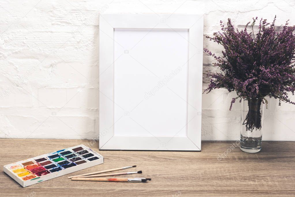 photo frame and drawing equipment on tabletop