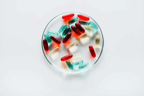 Colorful pills in petri dish — Stock Photo, Image