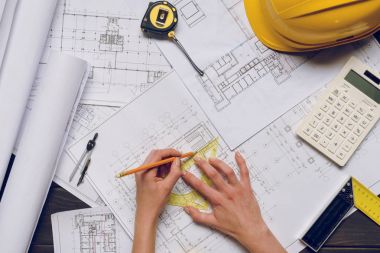 architect working on blueprints clipart