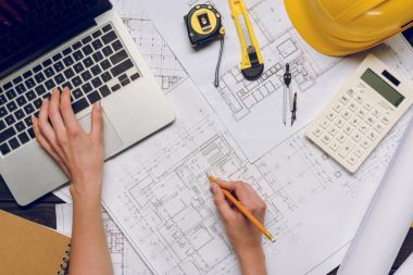 architect working on blueprints clipart