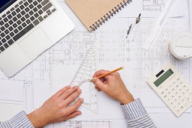 architect working with blueprints clipart