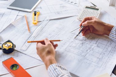 architect working with blueprints clipart