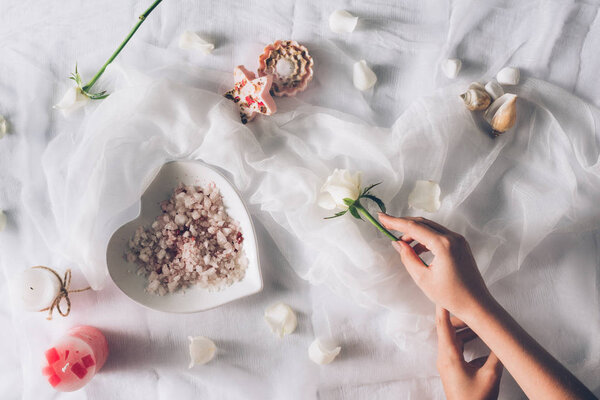woman holding white rose
