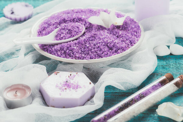Plate with violet bathroom salt for aromatherapy