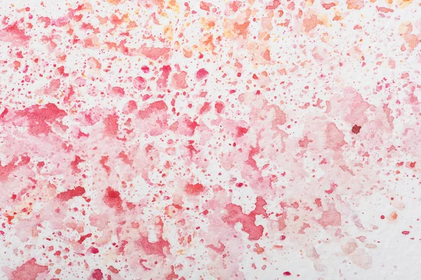 red and pink watercolor stains