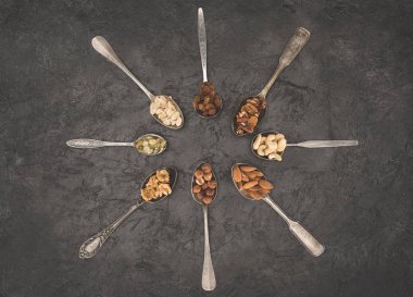 assorted nuts in spoons clipart