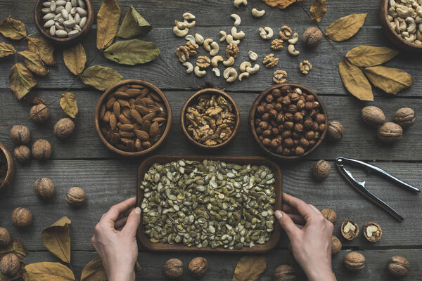assorted nuts and autumn leaves