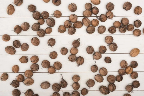 Walnuts on wooden table — Free Stock Photo