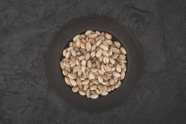 Pistachios on plate — Stock Photo, Image