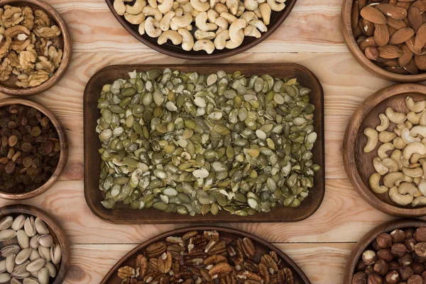 Pumpkin seeds and nuts — Stock Photo, Image