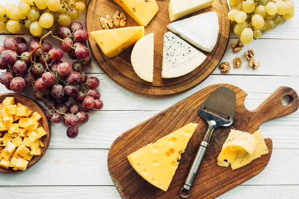 various types of cheese and grapes
