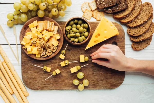 Woman holding canape — Stock Photo, Image