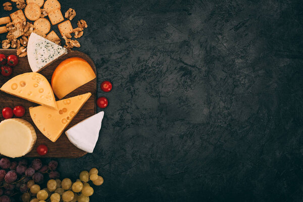 various types of cheese and grapes