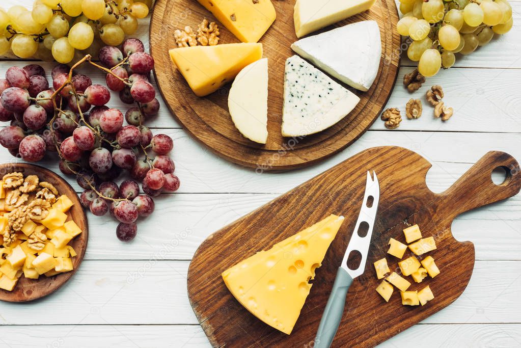 various types of cheese and grapes