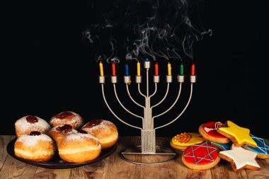 traditional jewish menorah and sweets clipart