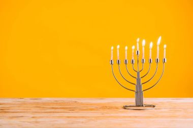 hanukkah celebrating with menorah clipart