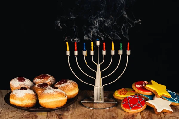 Traditional jewish menorah and sweets — Stock Photo, Image