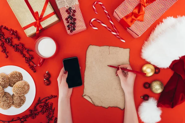 Woman writing present list — Stock Photo, Image