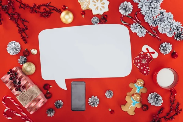 Christmas decorations and speech bubble — Stock Photo, Image