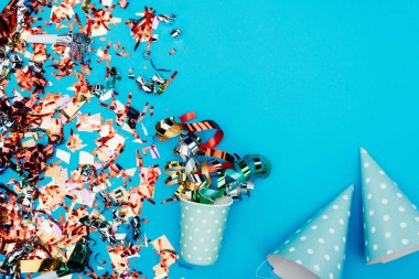 confetti with paper cup and party hats clipart