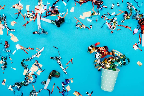 Spilled confetti and paper cup — Stock Photo, Image