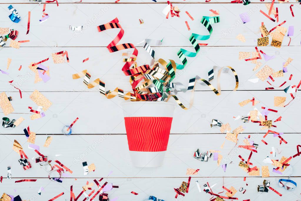 confetti spilling out of paper cup