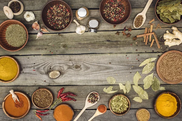 Bowls with spices and utensils — Stock Photo, Image