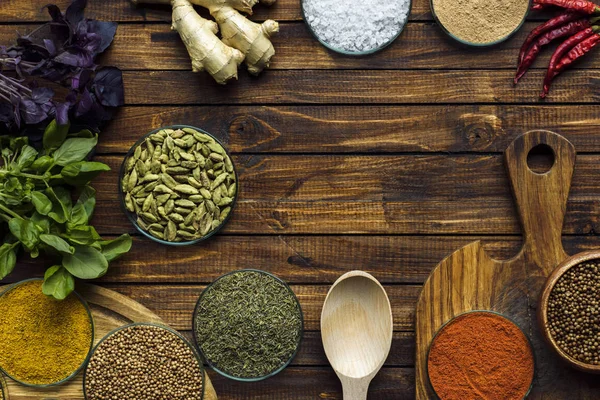 Various spices on wooden surface — Stock Photo, Image