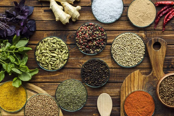Various spices on wooden surface — Stock Photo, Image
