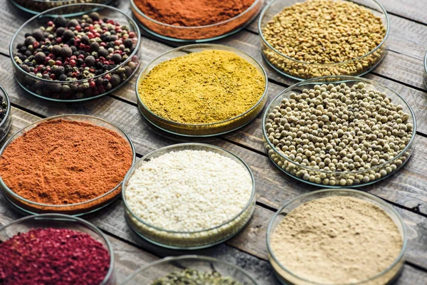 Glass bowls with different colorful spices — Stock Photo, Image