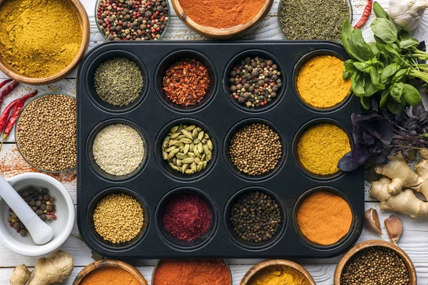 Black tray with spices — Stock Photo, Image