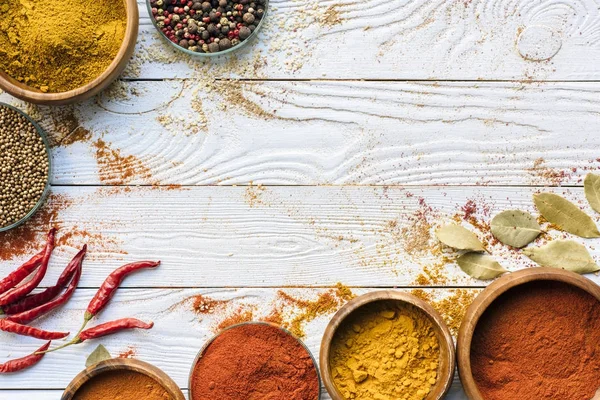 Scattered spices and glasses with spices — Stock Photo, Image
