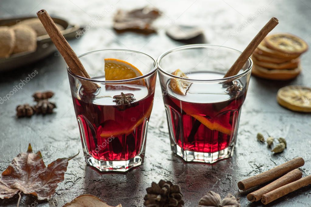 glasses of mulled wine with cinnamon sticks