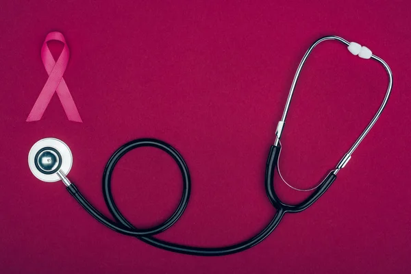 Stethoscope and breast cancer ribbon — Stock Photo, Image