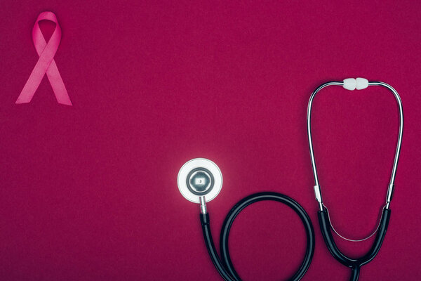stethoscope and breast cancer ribbon