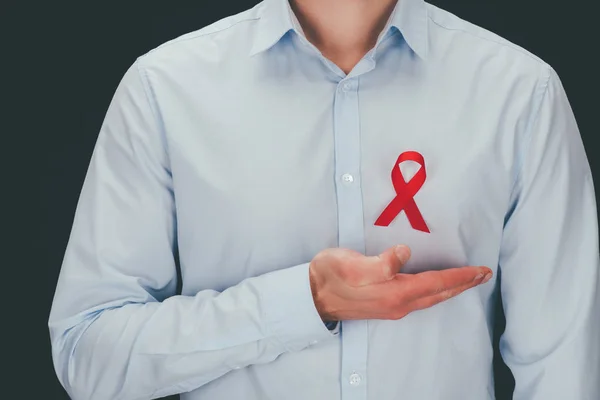 Man with red aids ribbon — Stock Photo, Image