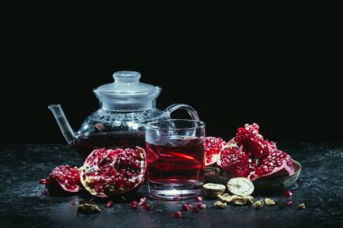 Glass and teapot with pomegranate juice clipart