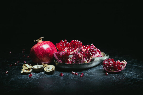 pomegranates in metal bowl