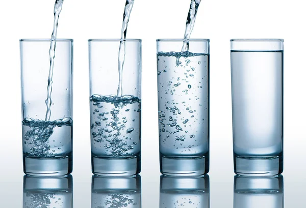 Glasses with different level of water — Stock Photo, Image