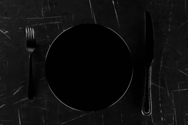 Placa con tenedor y cuchillo — Foto de Stock