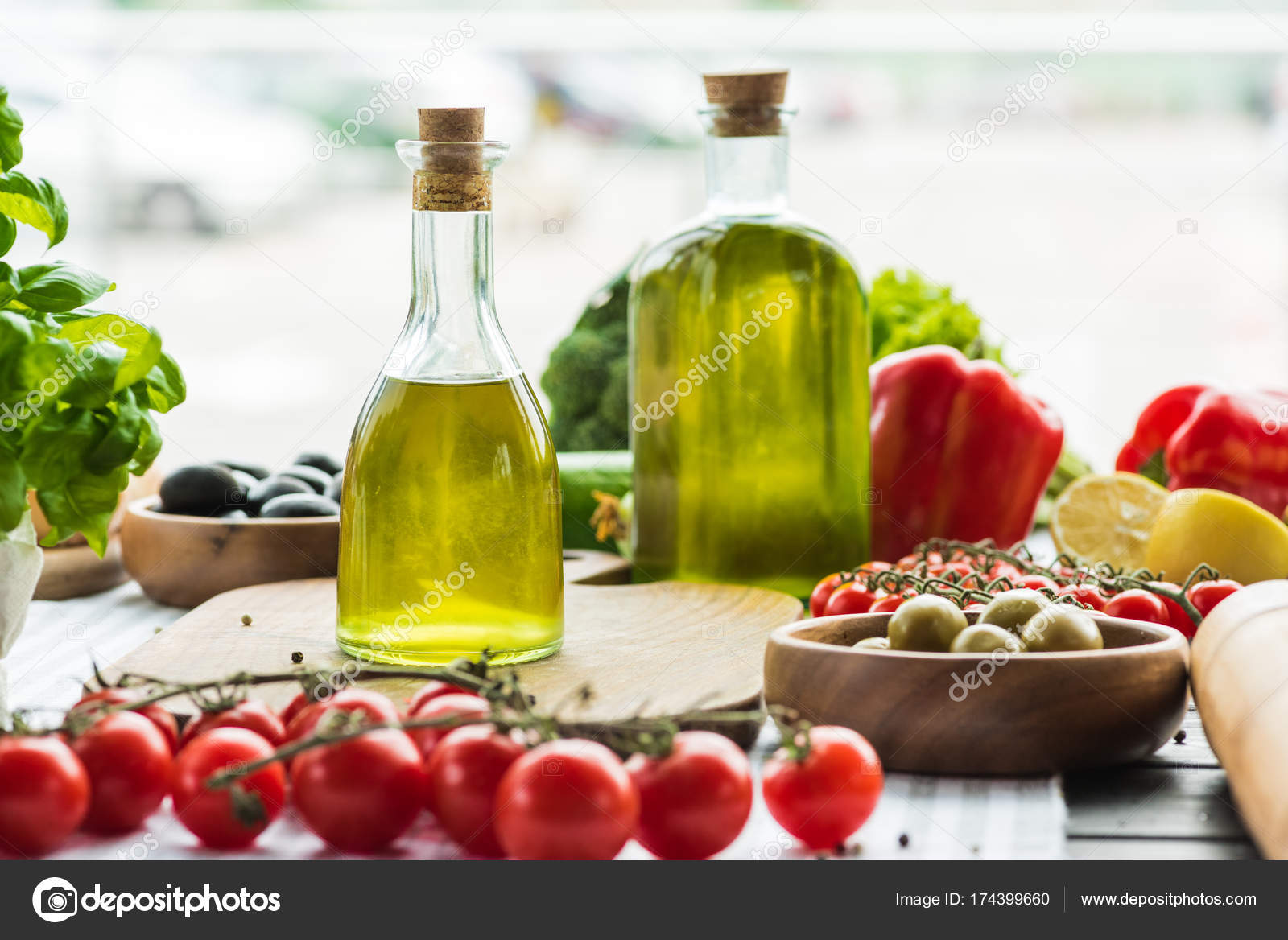 Olive oil bottles with vegetables — Stock Photo © VadimVasenin 174399660