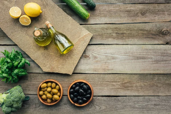 Olive bottles on table — Stock Photo, Image