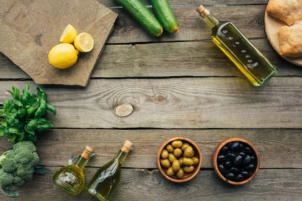 Olive bottles on table — Stock Photo, Image