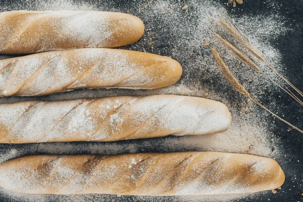 Baguettes and spikelets — Stock Photo, Image