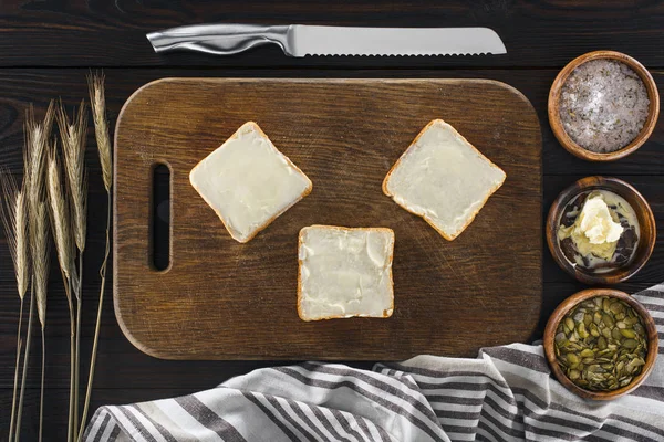 Toasts with butter and spikelets — Stock Photo, Image