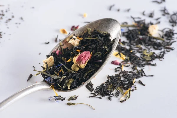 Herbal tea and spoon — Stock Photo, Image