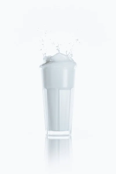 Splash of milk in glass — Stock Photo, Image