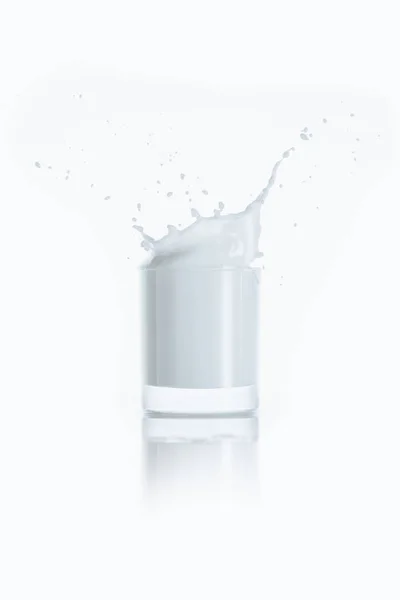 Glass of milk with splash — Free Stock Photo