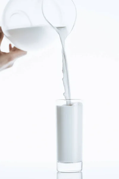 Milk pouring from milk jar — Free Stock Photo