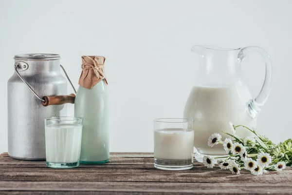 Fresh milk on shabby wooden tabletop — Stock Photo, Image